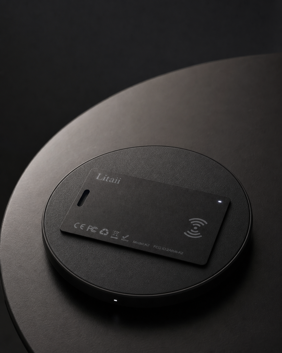 K2 tracking card on a wireless charging pad